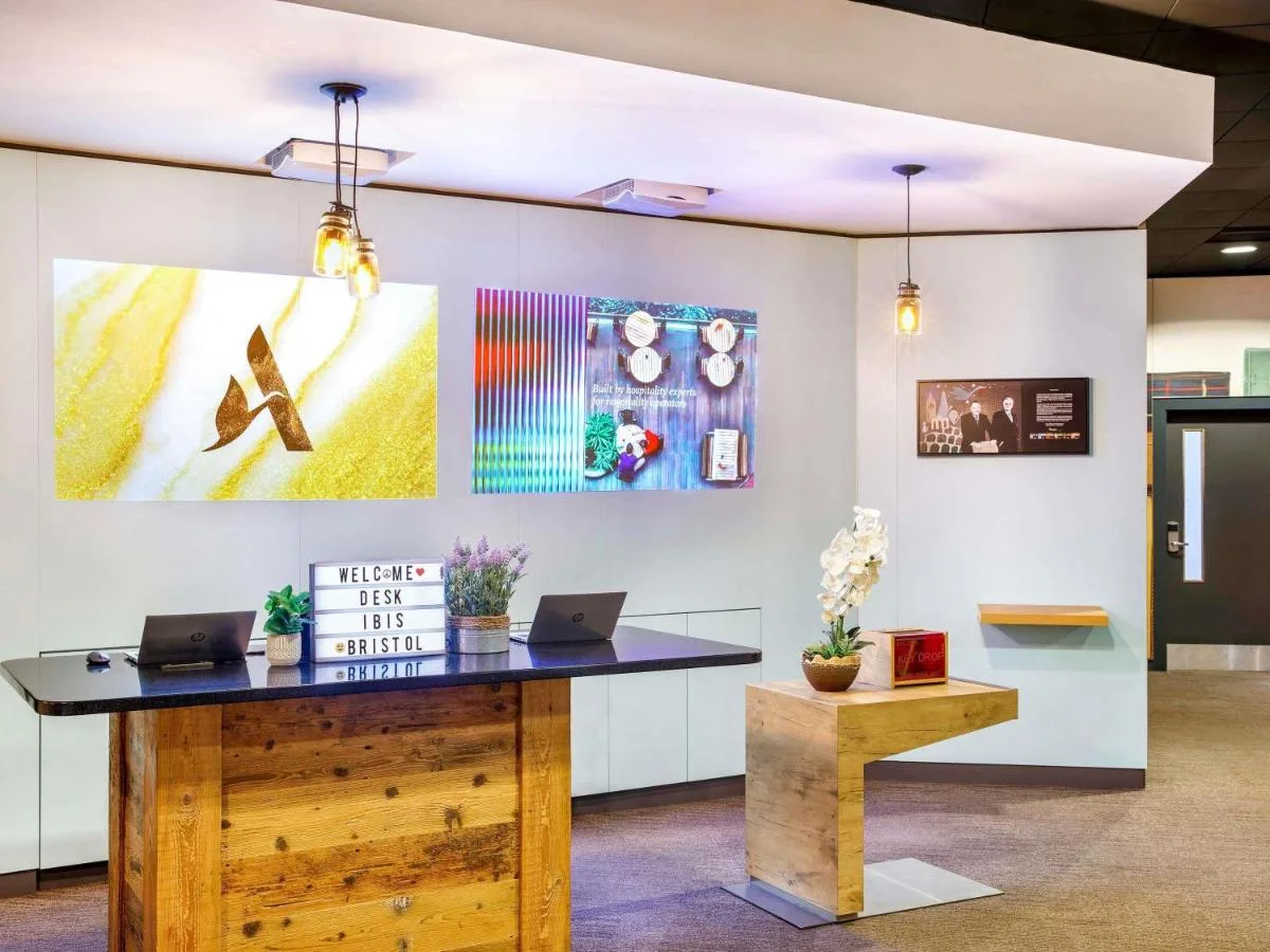 an office with a desk with two laptops on it at ibis Bristol Centre in Bristol